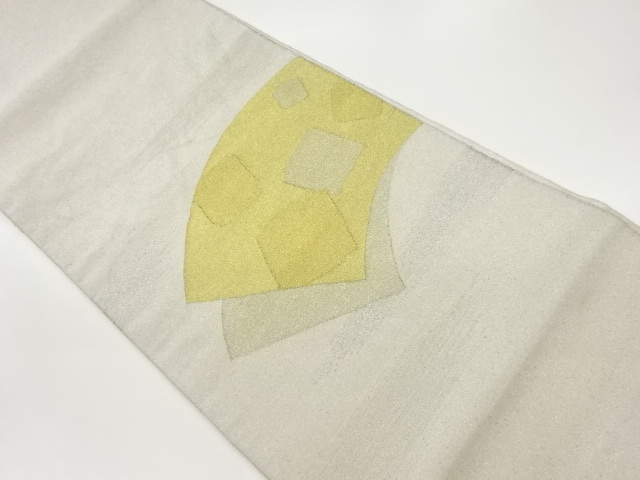 砂子綴れ地紙に色紙模様織出し袋帯